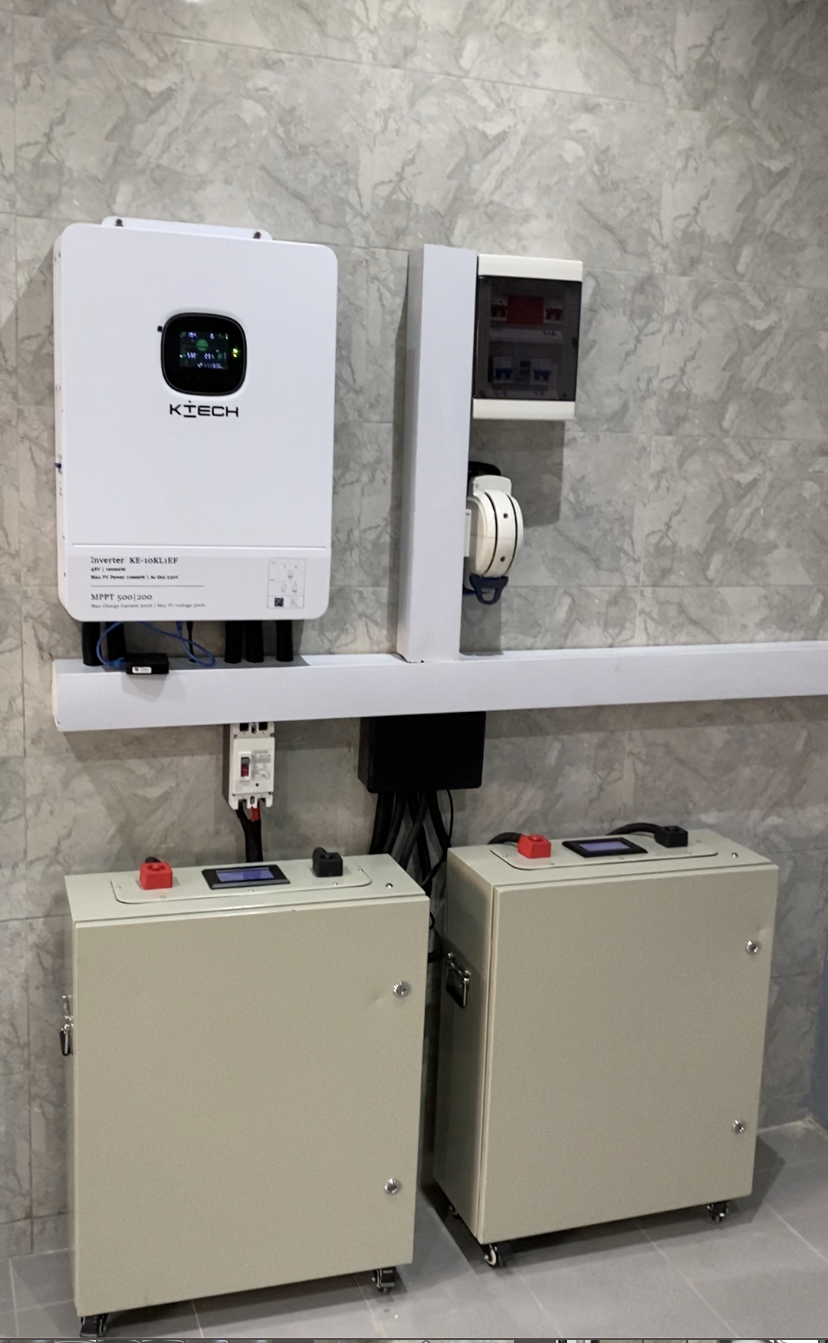 Wall-mounted K-Tech hybrid inverter with dual lithium battery cabinets, Maitama installation